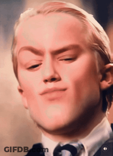 A Close Up Of A Man 'S Face With A Sound Button In The Lower Right Corner GIF