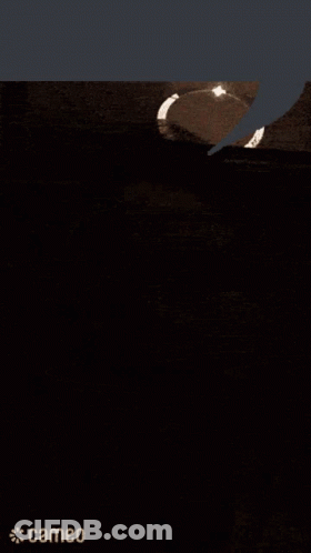 A Close Up Of A Man 'S Face With A Speech Bubble Above It . GIF