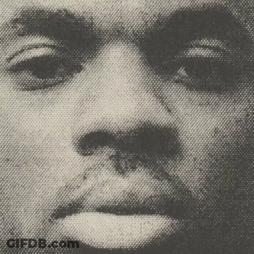 A Close Up Of A Man 'S Face With A Spider On It GIF