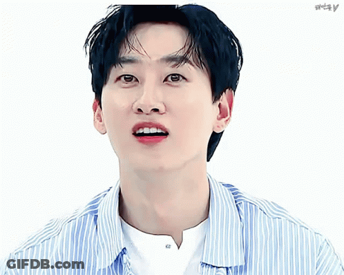 A Close Up Of A Man 'S Face With A Striped Shirt And A Pink Heart GIF