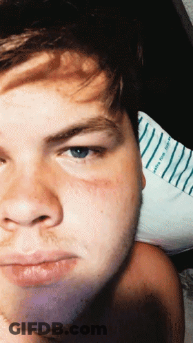 A Close Up Of A Man 'S Face With A Striped Shirt Behind Him That Says ' Happy Birthday ' GIF
