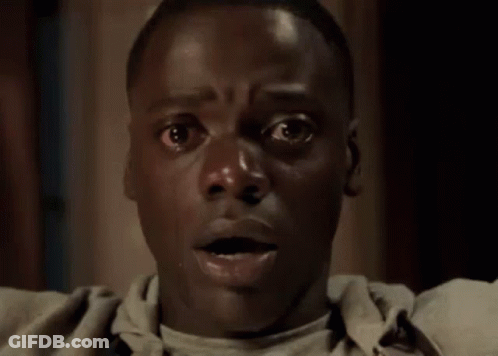 A Close Up Of A Man 'S Face With A Surprised Expression . GIF