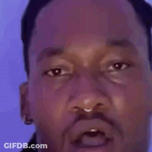 A Close Up Of A Man 'S Face With A Surprised Expression . GIF