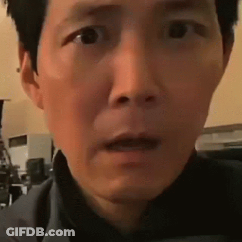 A Close Up Of A Man 'S Face With A Surprised Expression . GIF