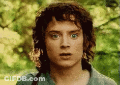 A Close Up Of A Man 'S Face With A Surprised Expression . GIF