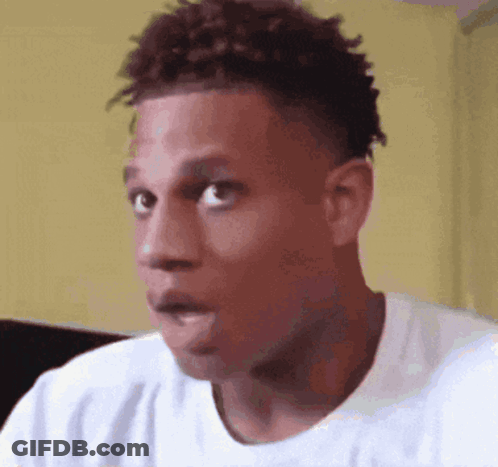 A Close Up Of A Man 'S Face With A Surprised Look On His Face GIF