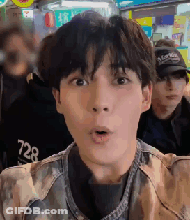 A Close Up Of A Man 'S Face With A Surprised Look On His Face GIF
