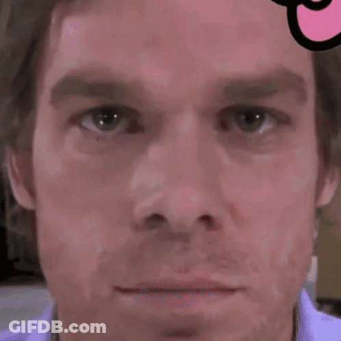 A Close Up Of A Man 'S Face With A Swiss Cross On It GIF