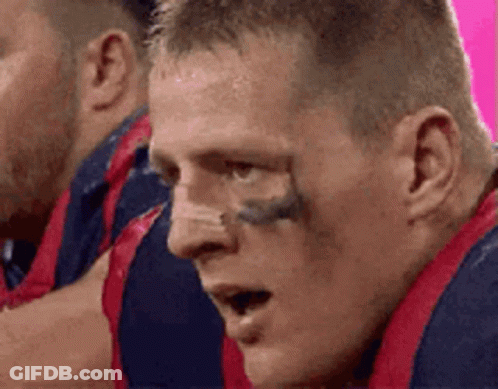 A Close Up Of A Man 'S Face With A Tattoo On His Eyebrow . GIF