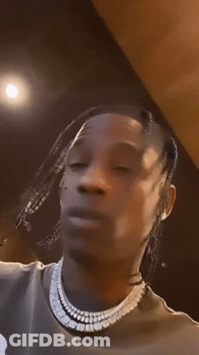 A Close Up Of A Man 'S Face With A Tattoo On His Face That Says Tnpk GIF