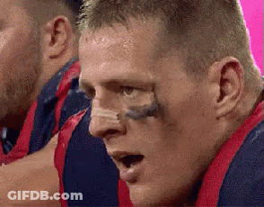 A Close Up Of A Man 'S Face With A Tattoo On His Nose GIF