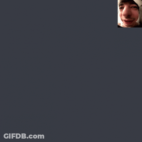 A Close Up Of A Man 'S Face With A Tattoo On His Shoulder GIF