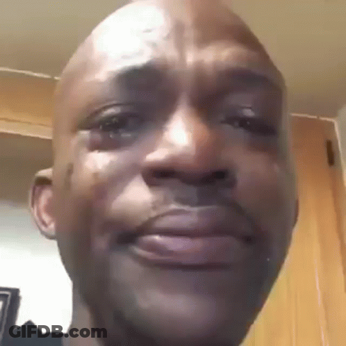 A Close Up Of A Man 'S Face With A Tear Coming Out Of His Eye . GIF