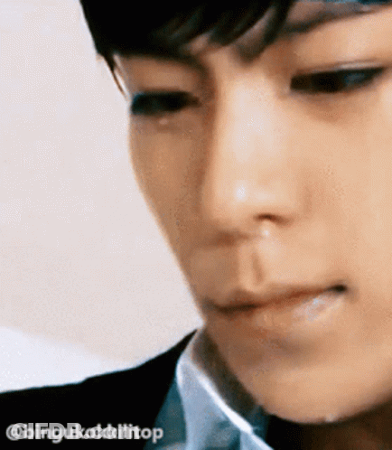 A Close Up Of A Man 'S Face With A Tear Running Down His Cheek GIF
