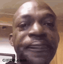 A Close Up Of A Man 'S Face With A Tear Running Down His Eye . GIF
