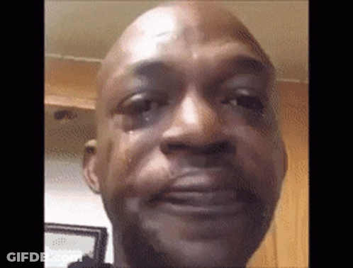 A Close Up Of A Man 'S Face With A Tear Running Down His Face . GIF
