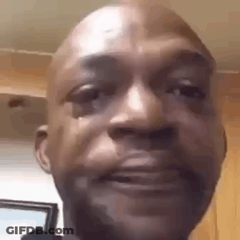A Close Up Of A Man 'S Face With A Tear Running Down His Face . GIF