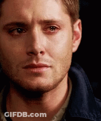 A Close Up Of A Man 'S Face With A Tear Running Down His Face . GIF