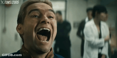 A Close Up Of A Man 'S Face With A Tomsj 2005 Watermark GIF