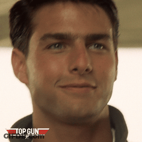 A Close Up Of A Man 'S Face With A Top Gun Logo On The Bottom GIF