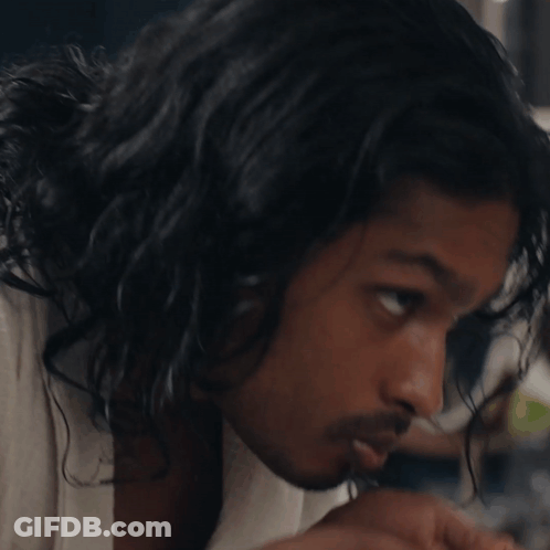 A Close Up Of A Man 'S Face With A Towel Around His Neck GIF
