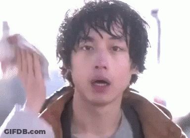 A Close Up Of A Man 'S Face With A Towel On His Head . GIF