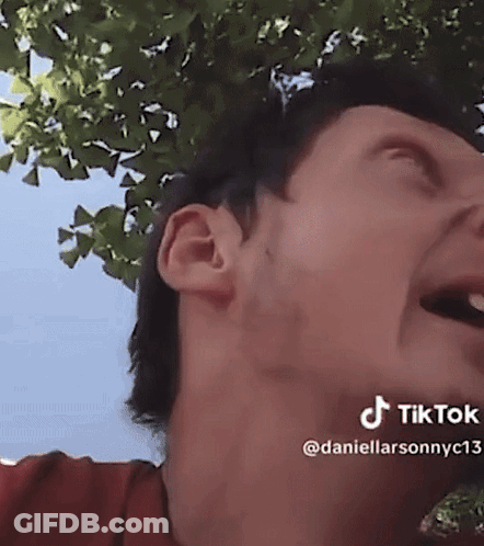 A Close Up Of A Man 'S Face With A Tree In The Background And A Tiktok Watermark GIF