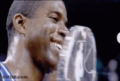 A Close Up Of A Man 'S Face With A Trophy On It GIF