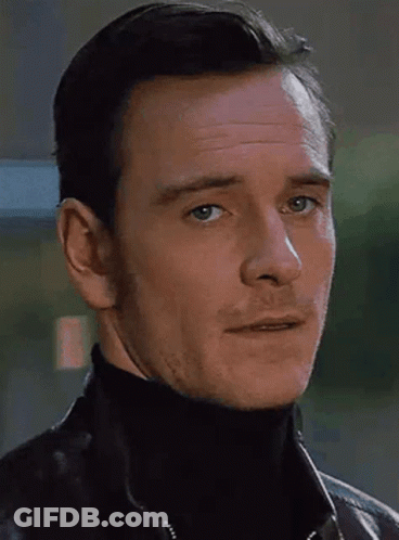 A Close Up Of A Man 'S Face With A Turtleneck And A Leather Jacket GIF