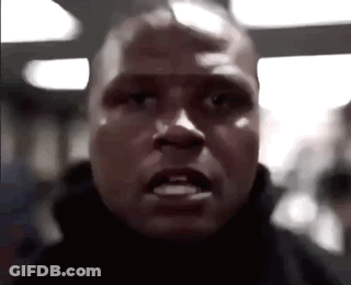 A Close Up Of A Man 'S Face With A Very Angry Expression . GIF