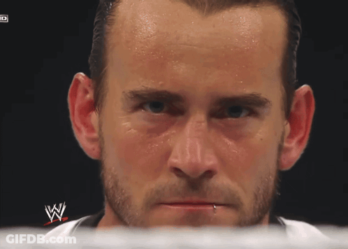 A Close Up Of A Man 'S Face With A W Logo On The Bottom GIF
