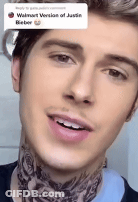 A Close Up Of A Man 'S Face With A Walmart Version Of Justin Bieber Written In The Corner GIF