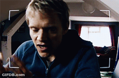 A Close Up Of A Man 'S Face With A White Arrow Pointing To The Left GIF