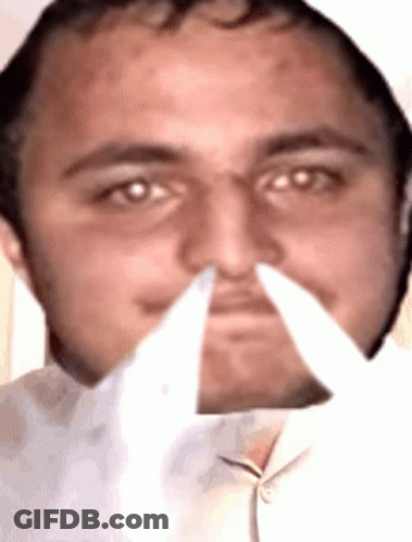 A Close Up Of A Man 'S Face With A White Background GIF