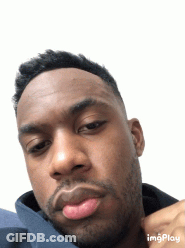 A Close Up Of A Man 'S Face With A White Background And The Word Imgplay At The Bottom GIF