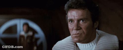 A Close Up Of A Man 'S Face With A White Collar GIF