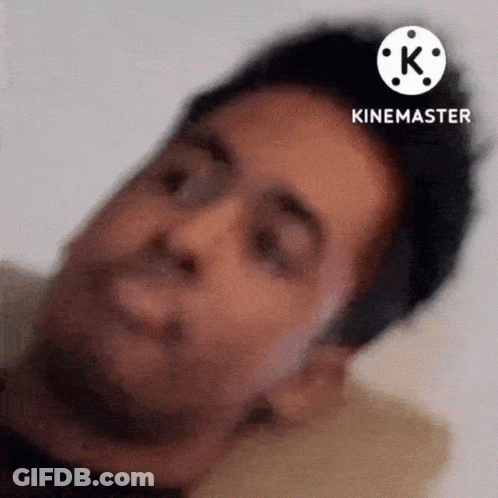 A Close Up Of A Man 'S Face With A White K On The Bottom GIF