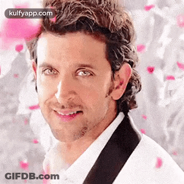 A Close Up Of A Man 'S Face With A White Shirt And A Black Tie . GIF