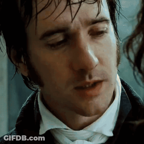 A Close Up Of A Man 'S Face With A White Shirt And Tie GIF
