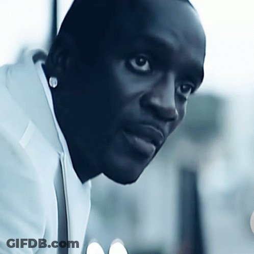 A Close Up Of A Man 'S Face With A White Shirt On GIF