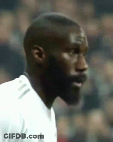 A Close Up Of A Man 'S Face With A White Shirt On GIF