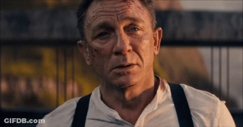 A Close Up Of A Man 'S Face With A White Shirt On GIF