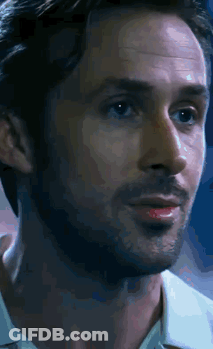 A Close Up Of A Man 'S Face With A White Shirt On GIF