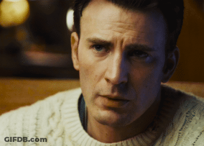 A Close Up Of A Man 'S Face With A White Sweater On GIF
