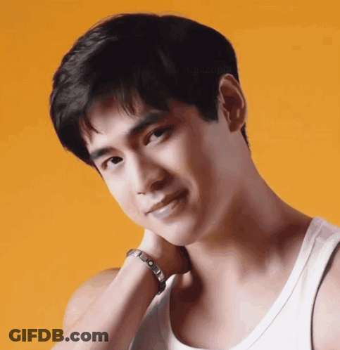 A Close Up Of A Man 'S Face With A White Tank Top On GIF
