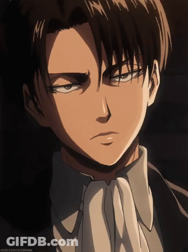 A Close Up Of A Man 'S Face With A White Tie And A Black Suit GIF