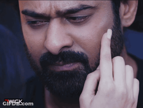A Close Up Of A Man 'S Face With A Wick Logo On The Bottom GIF