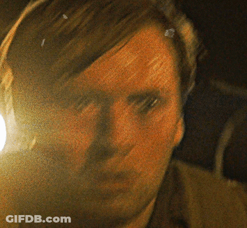 A Close Up Of A Man 'S Face With A Yellow Background GIF