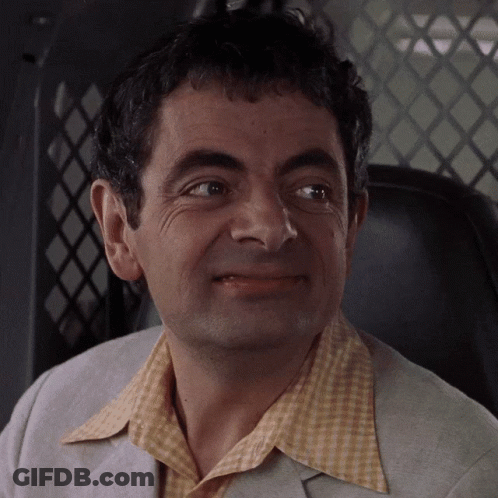 A Close Up Of A Man 'S Face With A Yellow Shirt On GIF