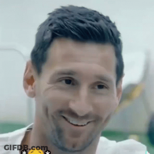 A Close Up Of A Man 'S Face With A Yellow Smiley Face GIF